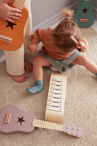 First toy guitar dark pink