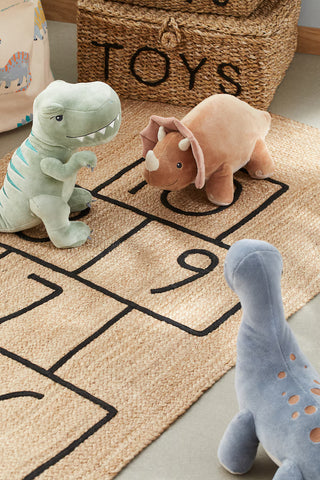 Braided jute rug with an embroidered hopscotch motif